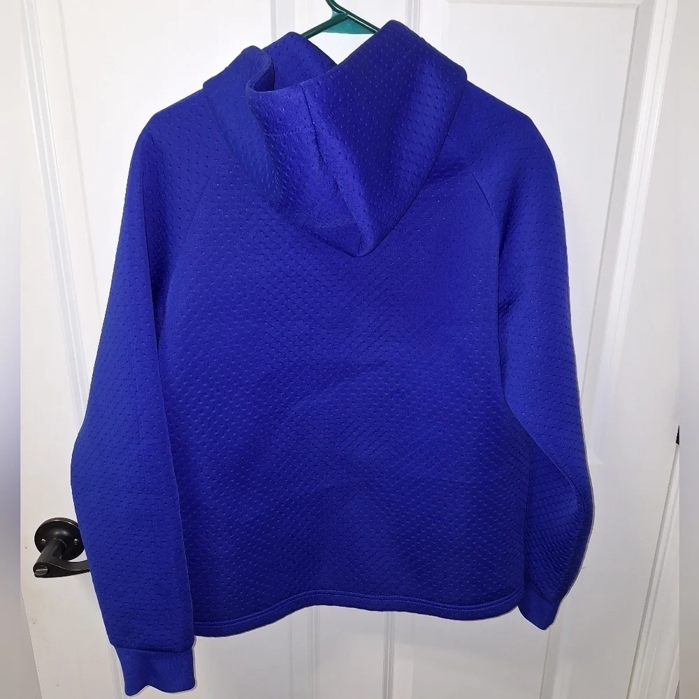 A Nike hooded full zip men's small jacket in blue. It's in excellent condition